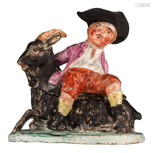 An 18thC charming Delft butter tub with a boy sitting on a g...