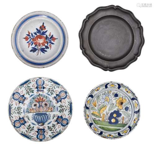 A collection of three faience plates and a matching pewter p...