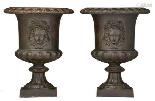 A decorative pair of patinated cast iron Medici vases, H 45 ...