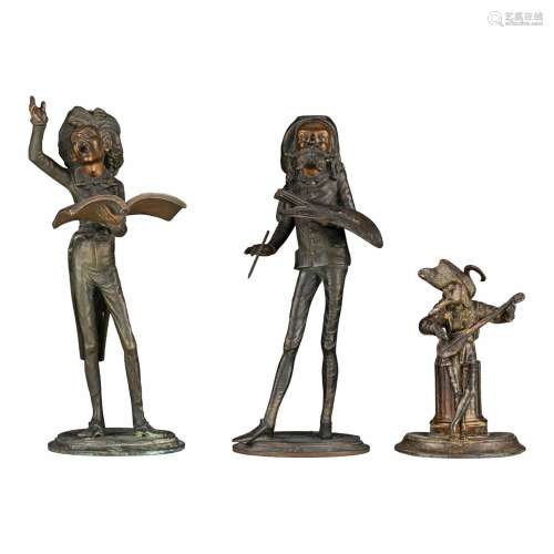 A pair and ditto smaller figural patinated spelter candlehol...