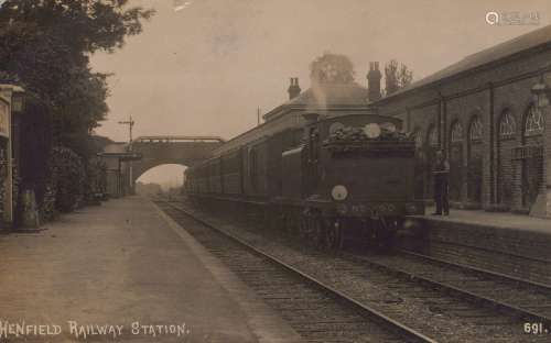 A photographic postcard titled 'Henfield Railway Station'.