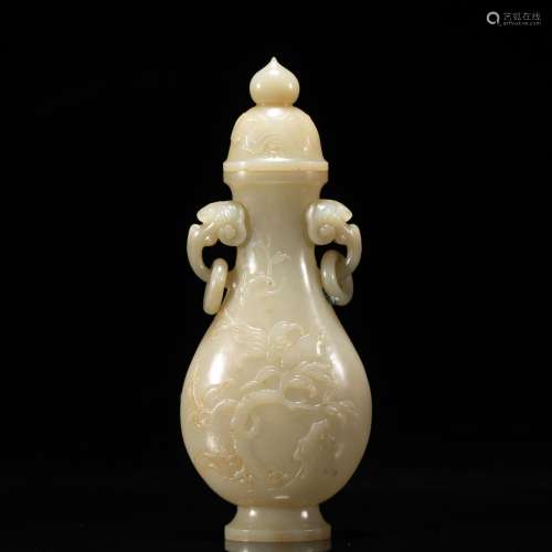 A CHINESE CARVED JADE VASE WITH COVER