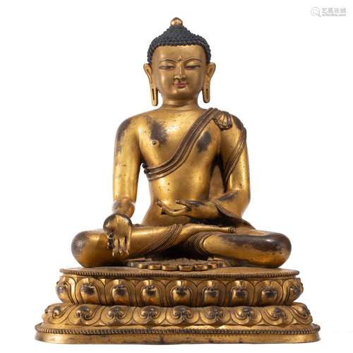 A CHINESE BRONZE-GILT FIGURE OF SHAKYAMUNI