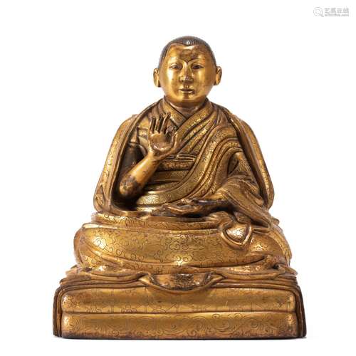 A TIBETAN BRONZE0GILT FIGURE OF MASTER GURU