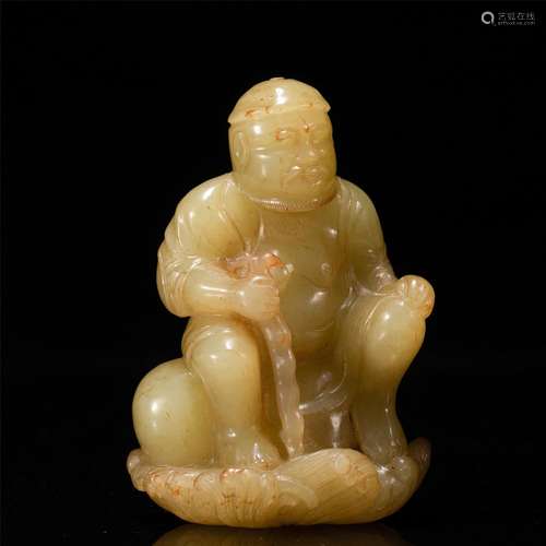 A SMALL JADE CARVING OF FIGURE