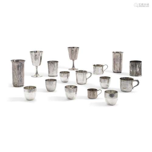 TWENTY-TWO AMERICAN STERLING SILVER CUPS AND MUGS by various...