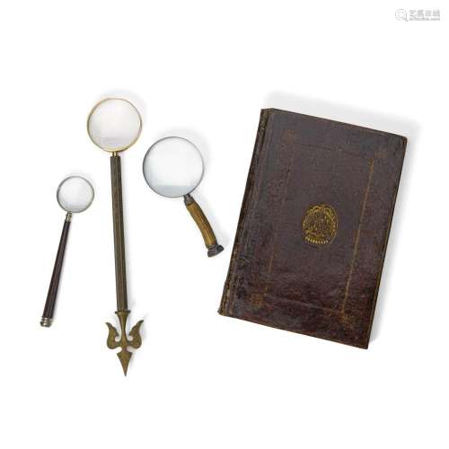 A GROUP OF THREE MAGNIFYING GLASSES