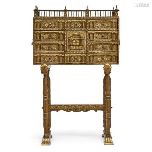 A SPANISH POLYCHROMED AND GILTWOOD VARGUEÑO ON STAND19th cen...