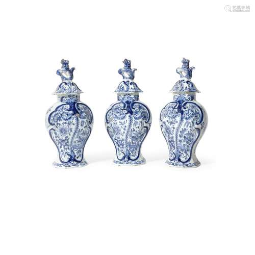 A SET OF THREE DELFT BLUE AND WHITE COVERED JARS 18th centur...