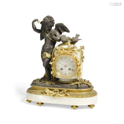 A FRENCH GILT AND PATINATED BRONZE, GILT METAL, AND ONYX FIG...