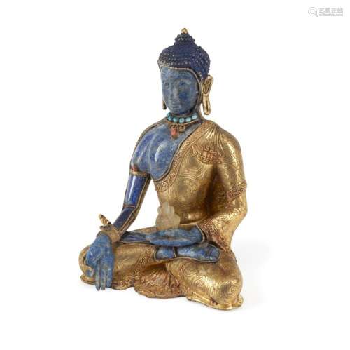 A THAI STYLE GILT METAL AND LAPIS FIGURE OF A SEATED BUDDHA