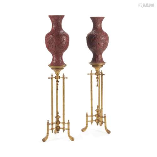 A PAIR OF CHINESE CINNABAR LACQUER STYLE VASES ON GILTWOOD B...