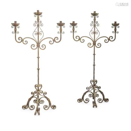 A PAIR OF WROUGHT IRON THREE-LIGHT TORCHÈRES