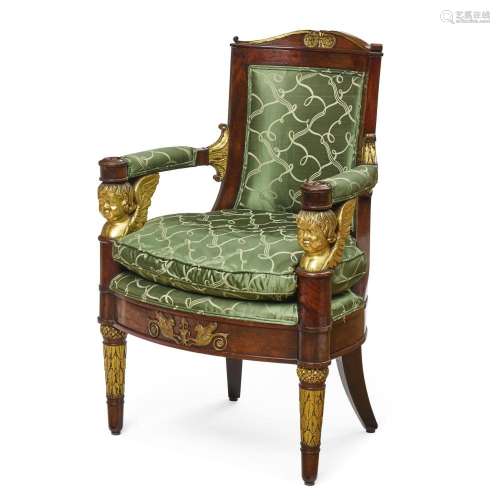 A CONTINENTAL NEOCLASSICAL STYLE PARCEL GILT MAHOGANY ARMCHA...