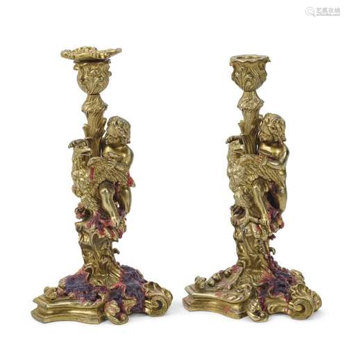 A PAIR OF NAPOLEON III GILT BRONZE FIGURAL CANDLESTICKSThird...