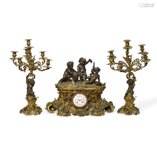 A NAPOLEON III GILT AND PATINATED BRONZE AND METAL THREE-PIE...