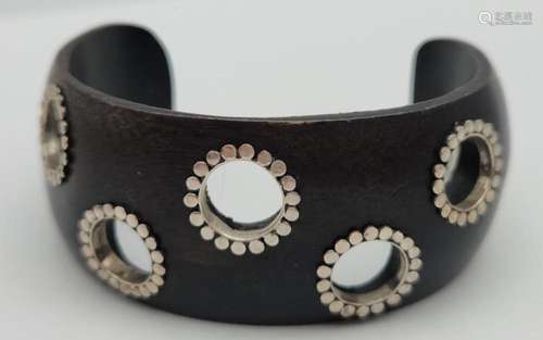 WOODEN CUFF WITH CUT OUT CIRCULAR DESIGN