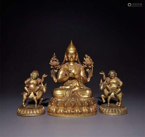 A Set of Three Chinese Gilt Bronze Figures of Buddha