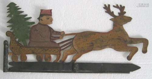 Man with x-mas tree and reindeer weathervane