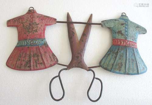 Tailor's trade sign dresses and scissors . Frocks emboss...