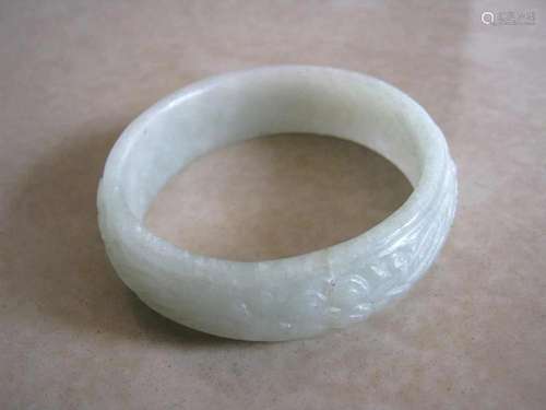 Jade bangle , fine design engraved .