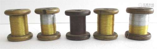 Five wooden spools