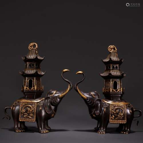 , old copper flower type gold elephant tower lamp of a coupl...
