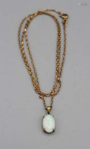 An Australian opal 14k stamped pendant on a 20 9ct gold hall...