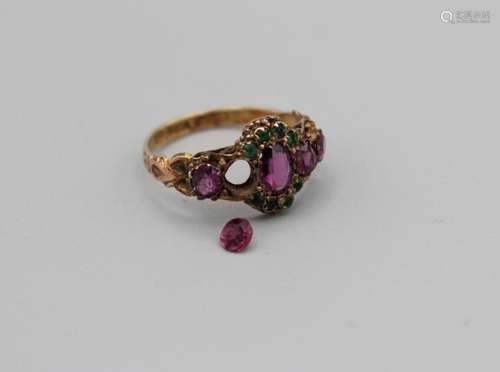 A garnet and green stone 15ct gold hallmarked- as found- one...