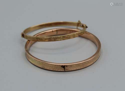 A pair of engraved bangles,, one hallmarked hinge bangle wit...