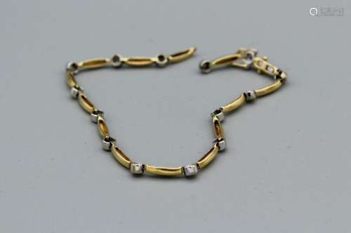 An 18ct gold and diamond bracelet with a broken link, gross ...