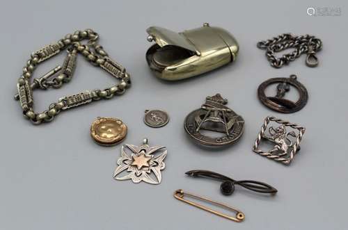 A selection of gold and silver jewellery along with other in...