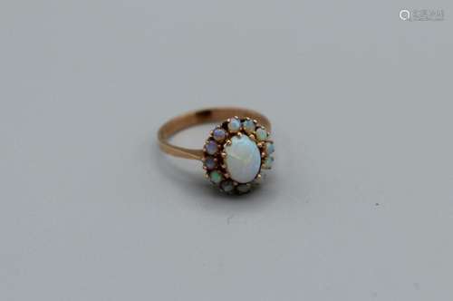 An opal cluster ring in rose yellow metal, size P, unmarked,...