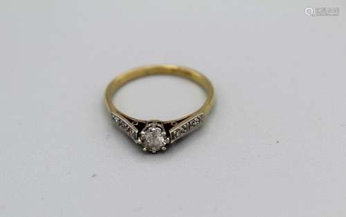 A diamond engagement ring set with a central old cut diamond...