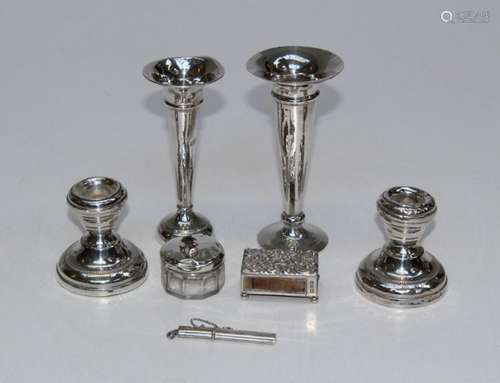 A pair of short loaded candlesticks, two loaded posy vases, ...