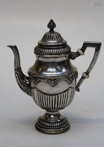 A Middle Eastern white metal teapot of demi-reeded Neo Class...