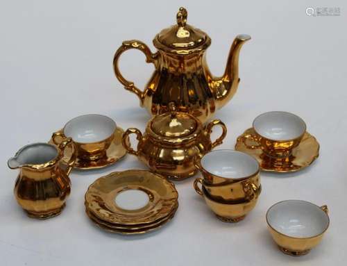 A mid 20th century Bavarian gilded porcelain six place coffe...