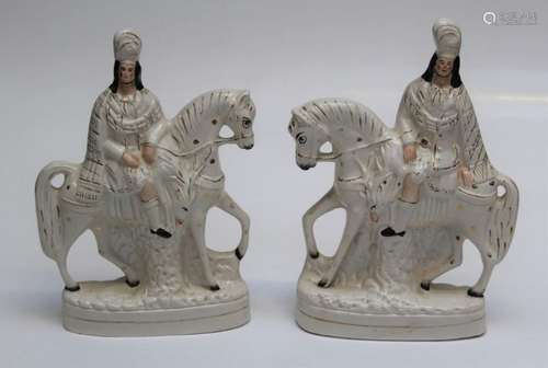 A pair of Victorian Staffordshire figures, each of a Noblema...