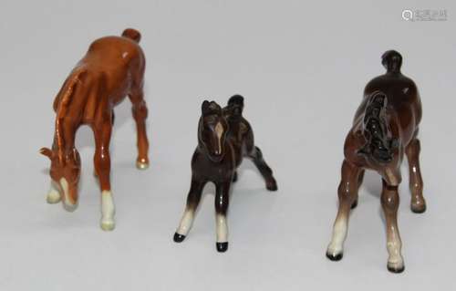 A Beswick figure 1085 foal in gloss brown, H9cm, a Beswick m...