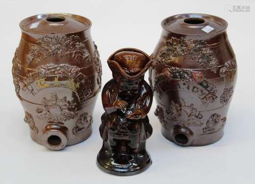 Two late 19th century stoneware spirit flasks, each decorate...