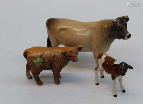 A Beswick figure of a Charolais calf, H7.5cm, another of a H...