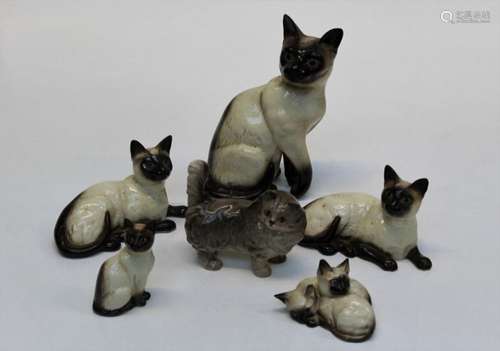 A group of five Beswick figures of Siamese cats comprising o...