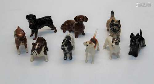 A group of ten Beswick figures of dogs, a Rottweiler, H8cm, ...