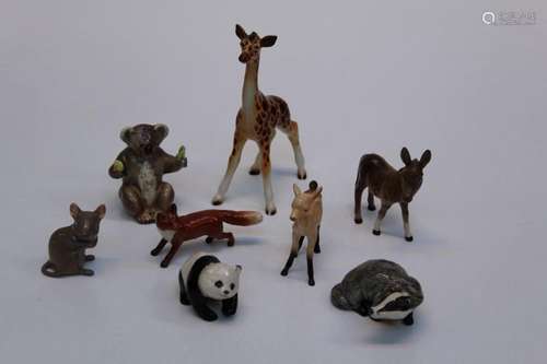 A group of Beswick animal figures comprising a foal, tail do...