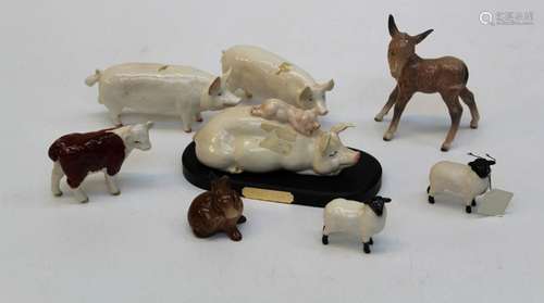 A group of eight Beswick farm figures comprising a black fac...