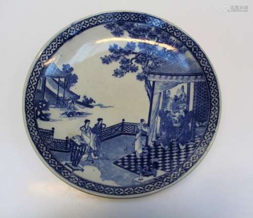 An early 20th century Japanese blue and white charger, decor...