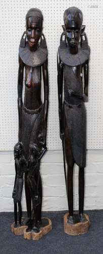 A pair of 20th century well carved ebony figures of a Maasai...