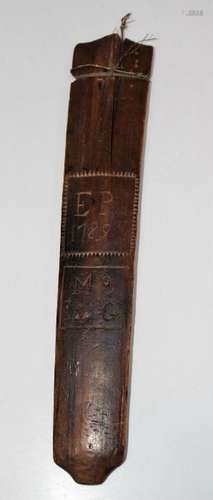 A George III treen stay busk, chip carved and decorated with...