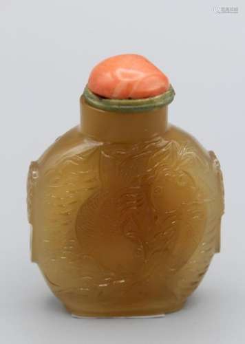 Snuff Bottle. Chalcedory of flattened ovoid form on a raised...