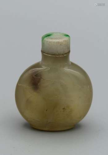 Snuff Bottle. Chalcedony of compressed round form on a raise...